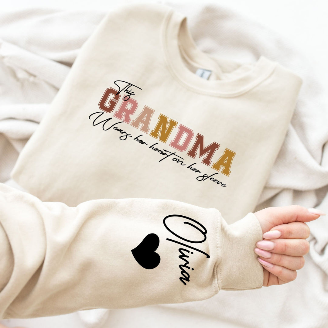 Mamie's Chaleureux Sweatshirt: Grandkid's Nom sur Manche